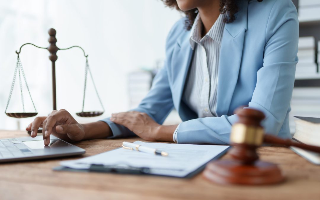 A young women African American lawyer lawsuit studying cases for clients in a law firm to fight against their parties in the courts. law and attorney concepts.